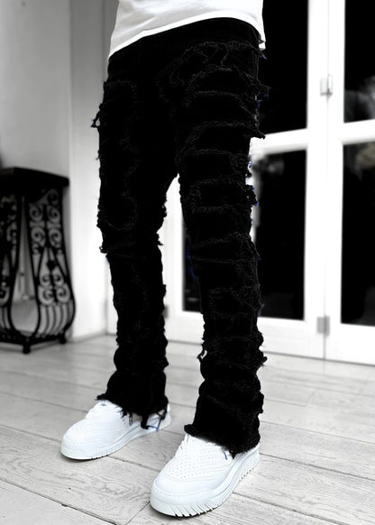 Patched Tight Fit Stacked Jeans